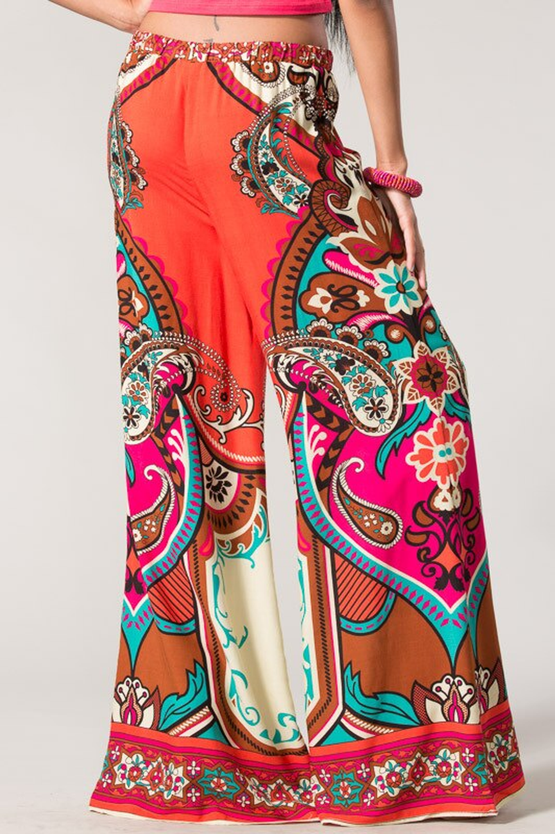Wide-leg paisley palazzo pants with elastic waistband and colorful red-and-cream print
