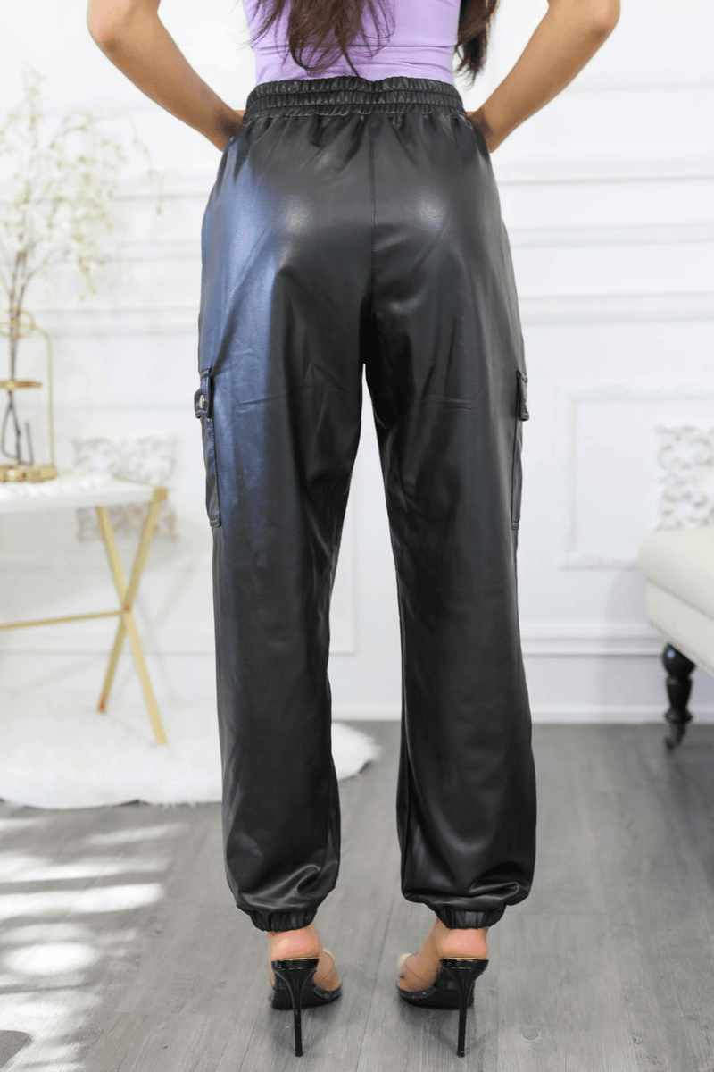 Dark faux leather cargo jogger pants, front view, elastic cuffed ankles