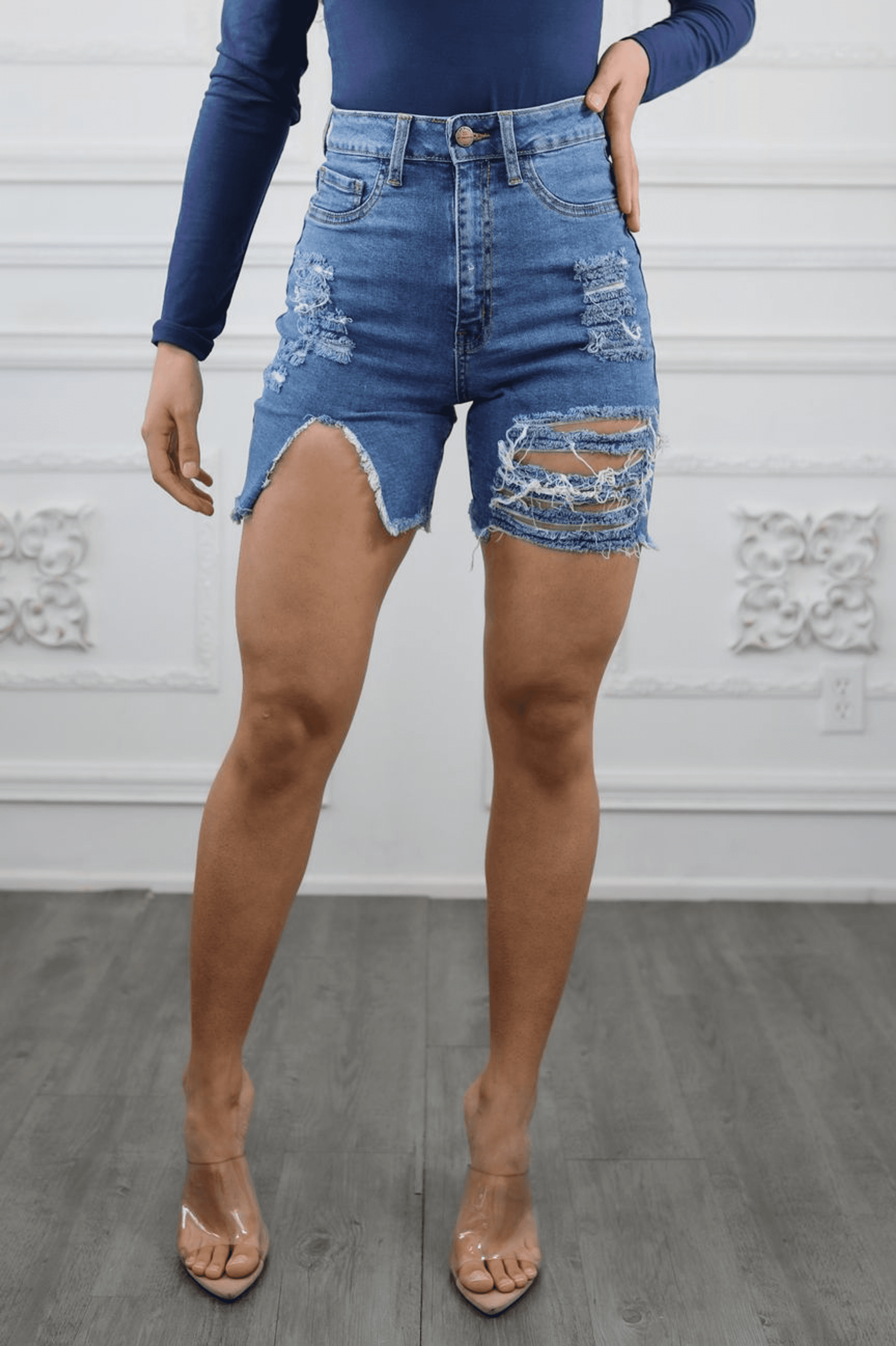 Women’s distressed cut-out high waist denim shorts with front rips and frayed hem