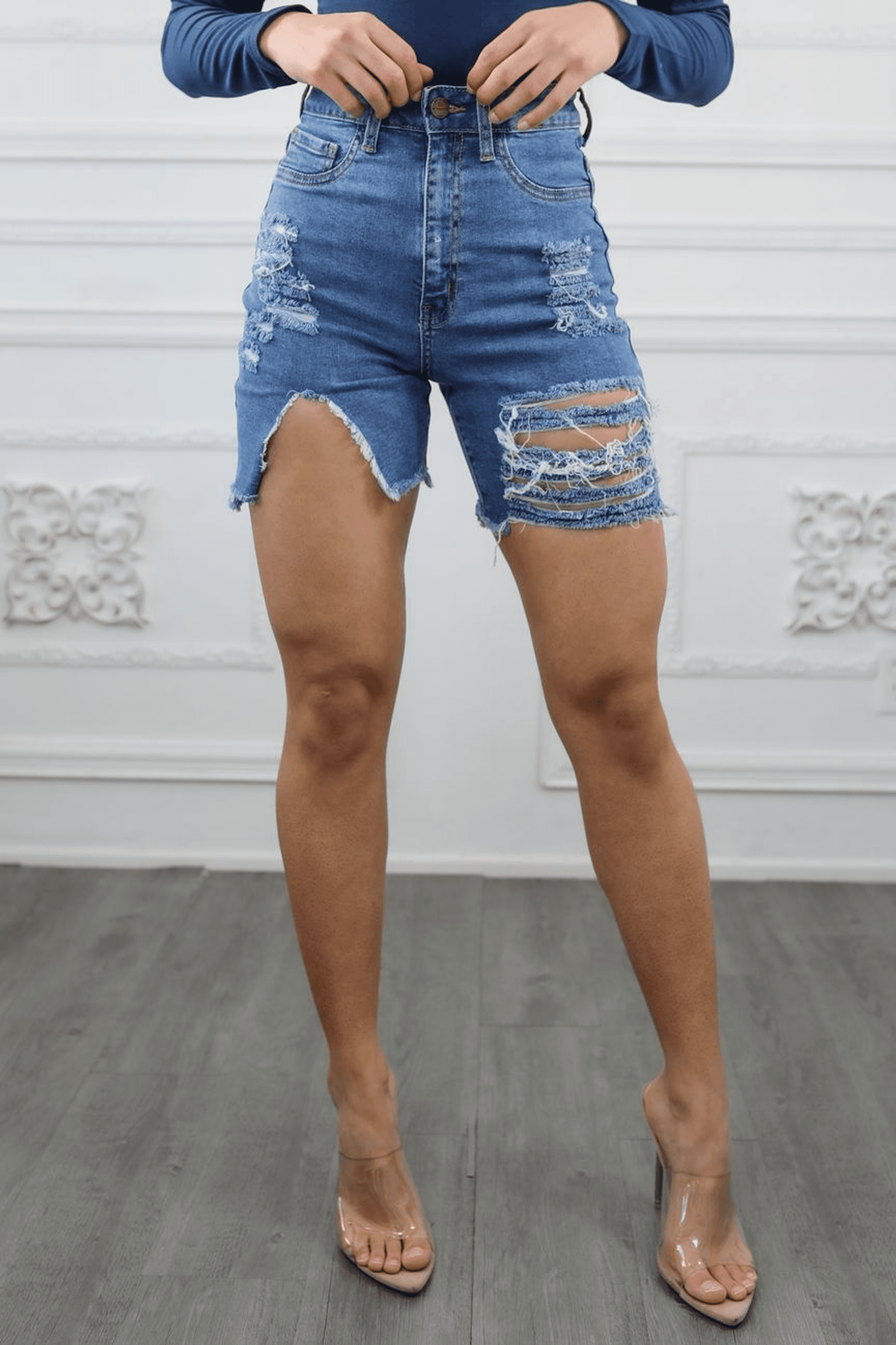 Women’s cut-out high waist distressed denim shorts with frayed edges and patch detailing