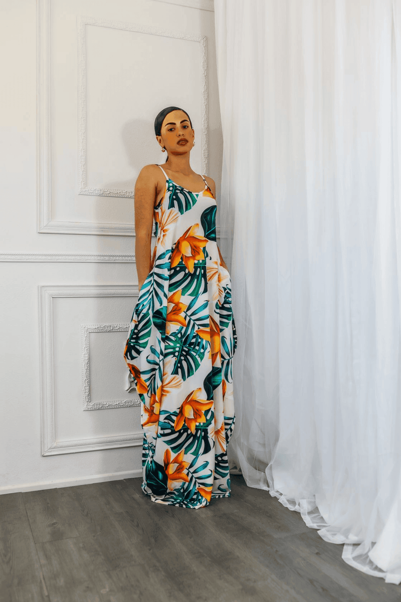 Tropical floral maxi dress with spaghetti straps and gathered tiered skirt