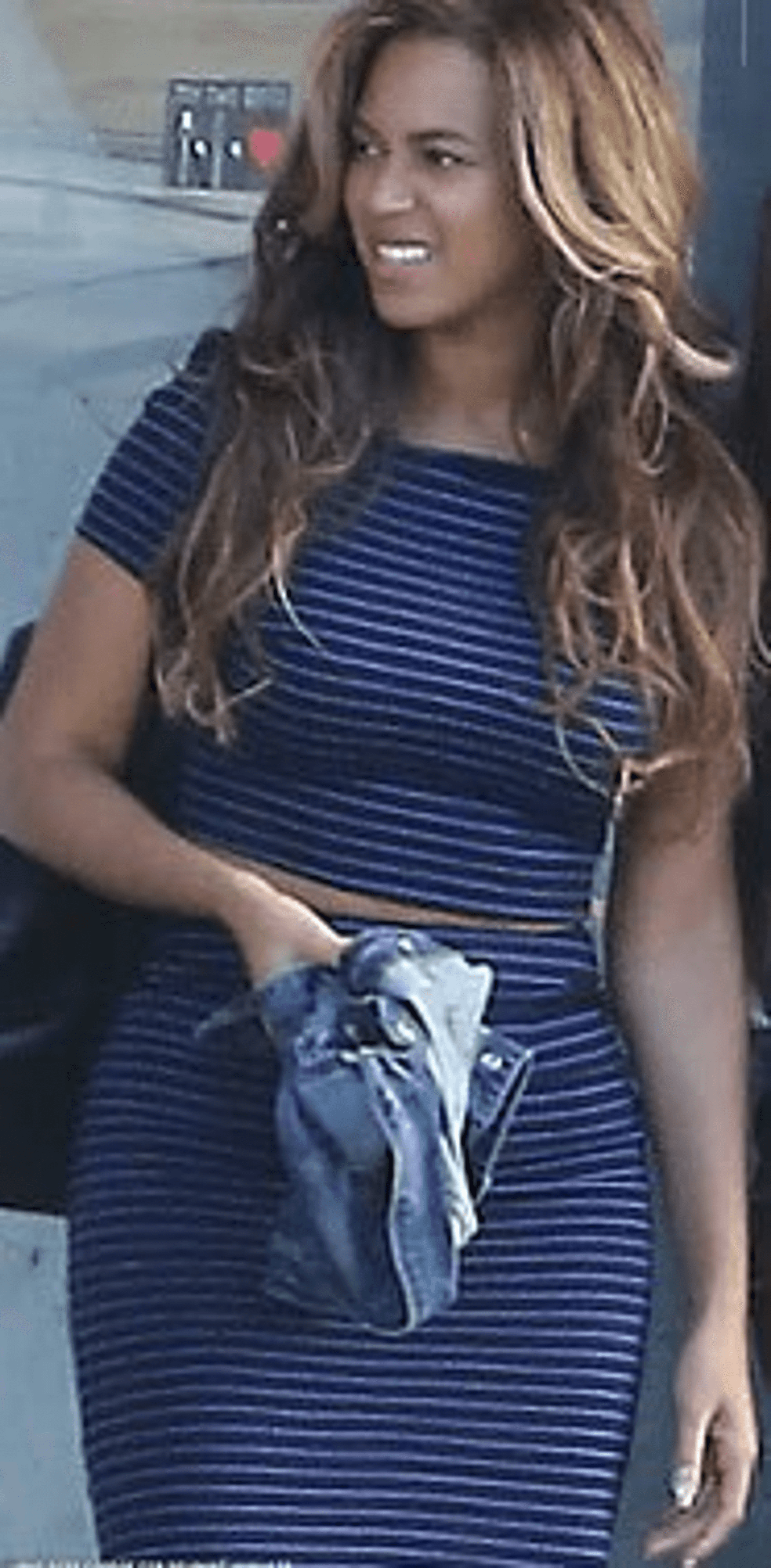 Blue and white striped sleeveless dress with tied waist detail