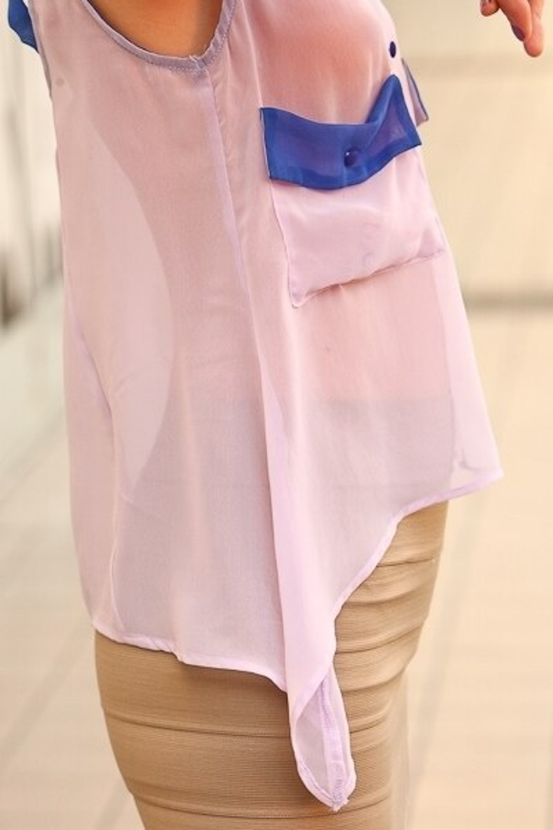 Sheer sleeveless blouse with blue pocket accents and high-low curved hem