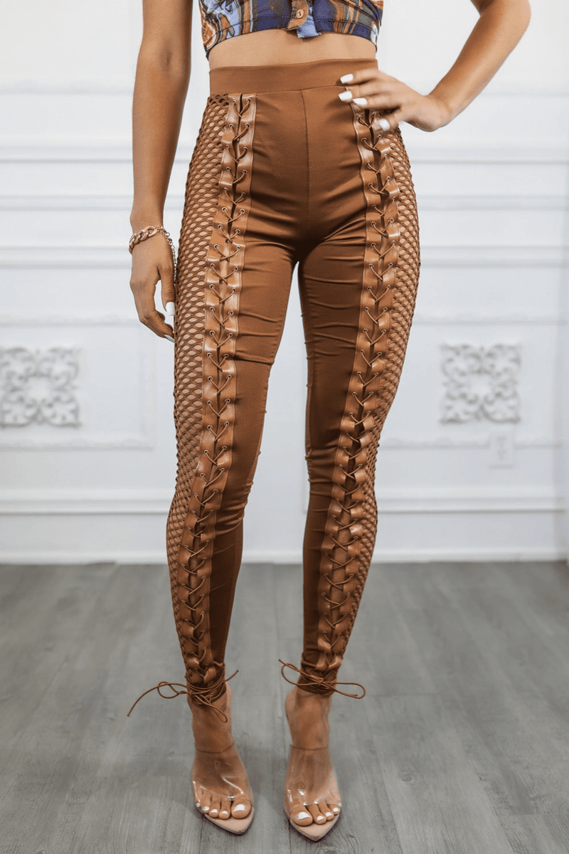 Brown fitted pants featuring side fishnet contrast and crisscross lace-up sides