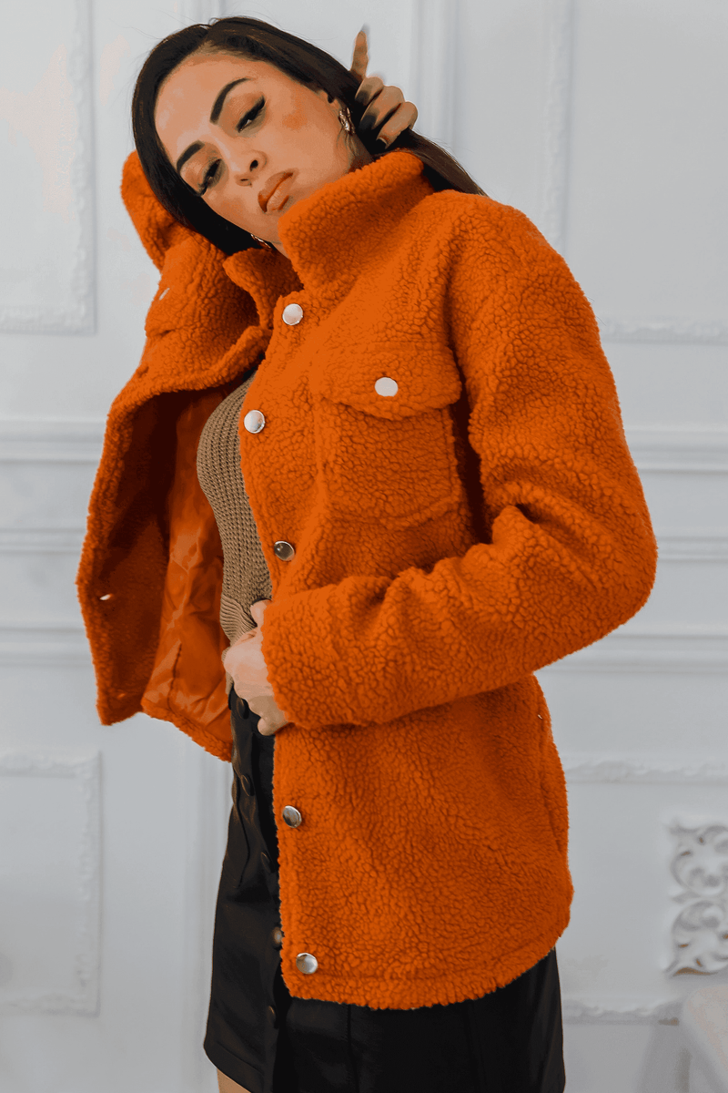 Orange sherpa jacket with snap buttons and flap pockets, front close-up