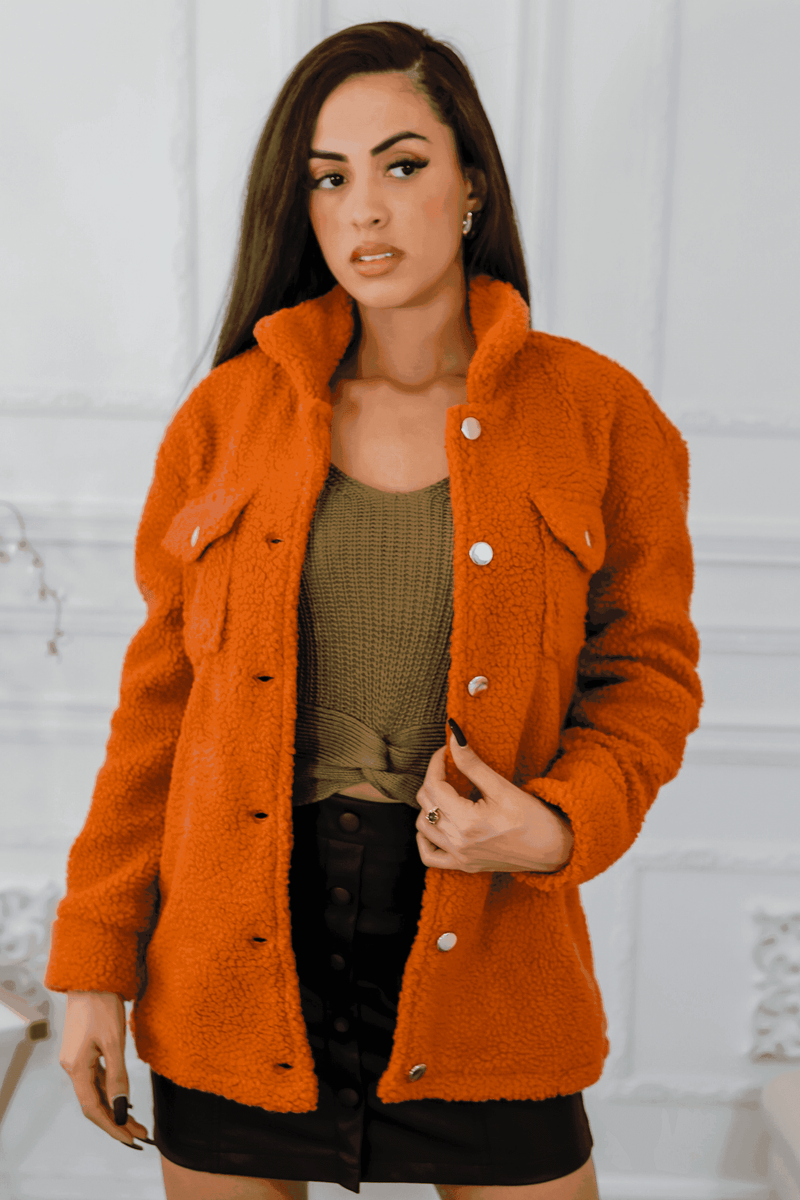 Orange sherpa jacket with button front, notch collar, and flap pockets