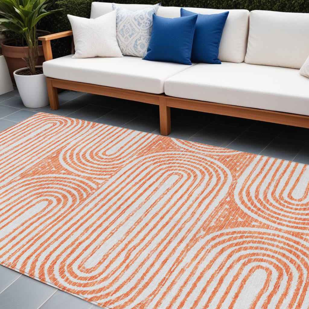 10' X 14' Orange and Ivory Abstract Washable Non Skid Indoor Outdoor Area Rug