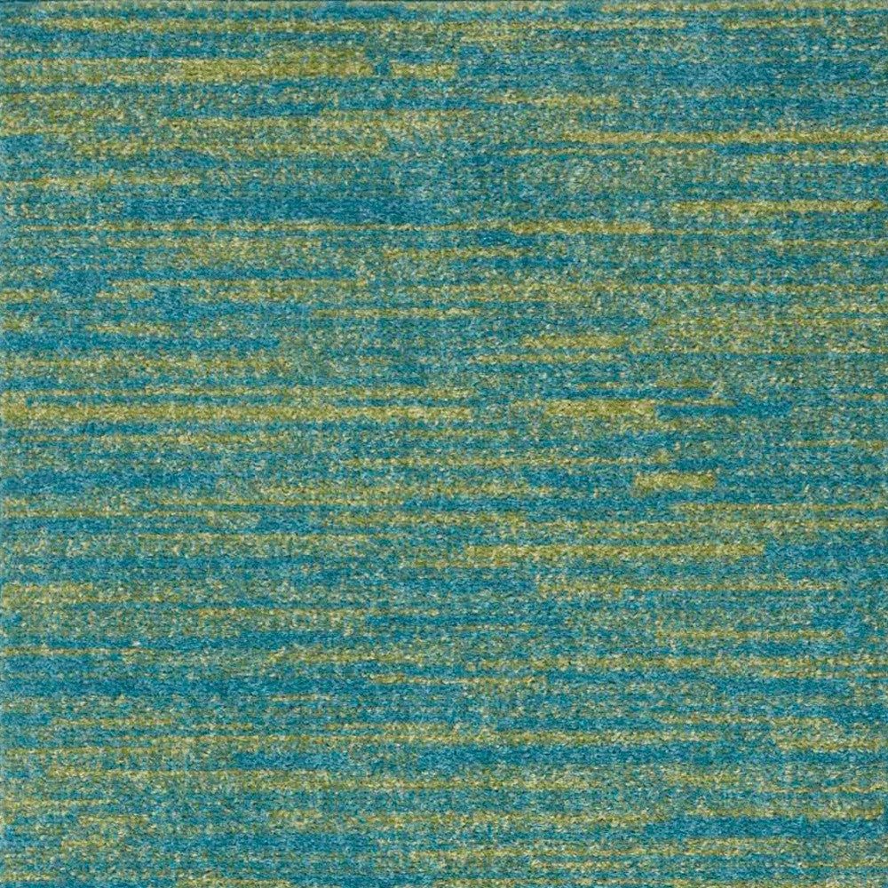 Teal and gold abstract area rug, soft texture, durable synthetic material, modern design for contemporary spaces.