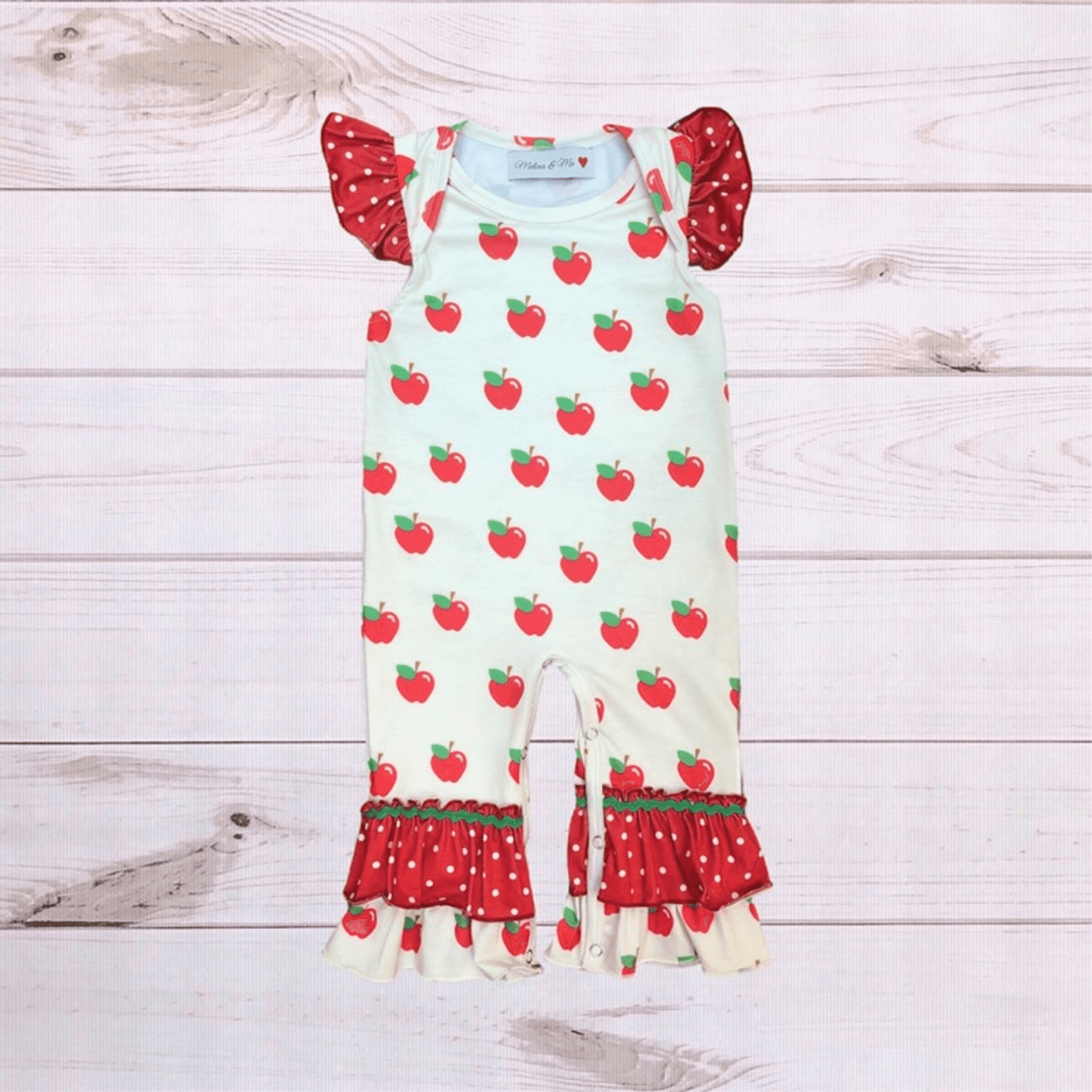 Apple-print short romper with red polka-dot puff sleeves and ruffled cuffs