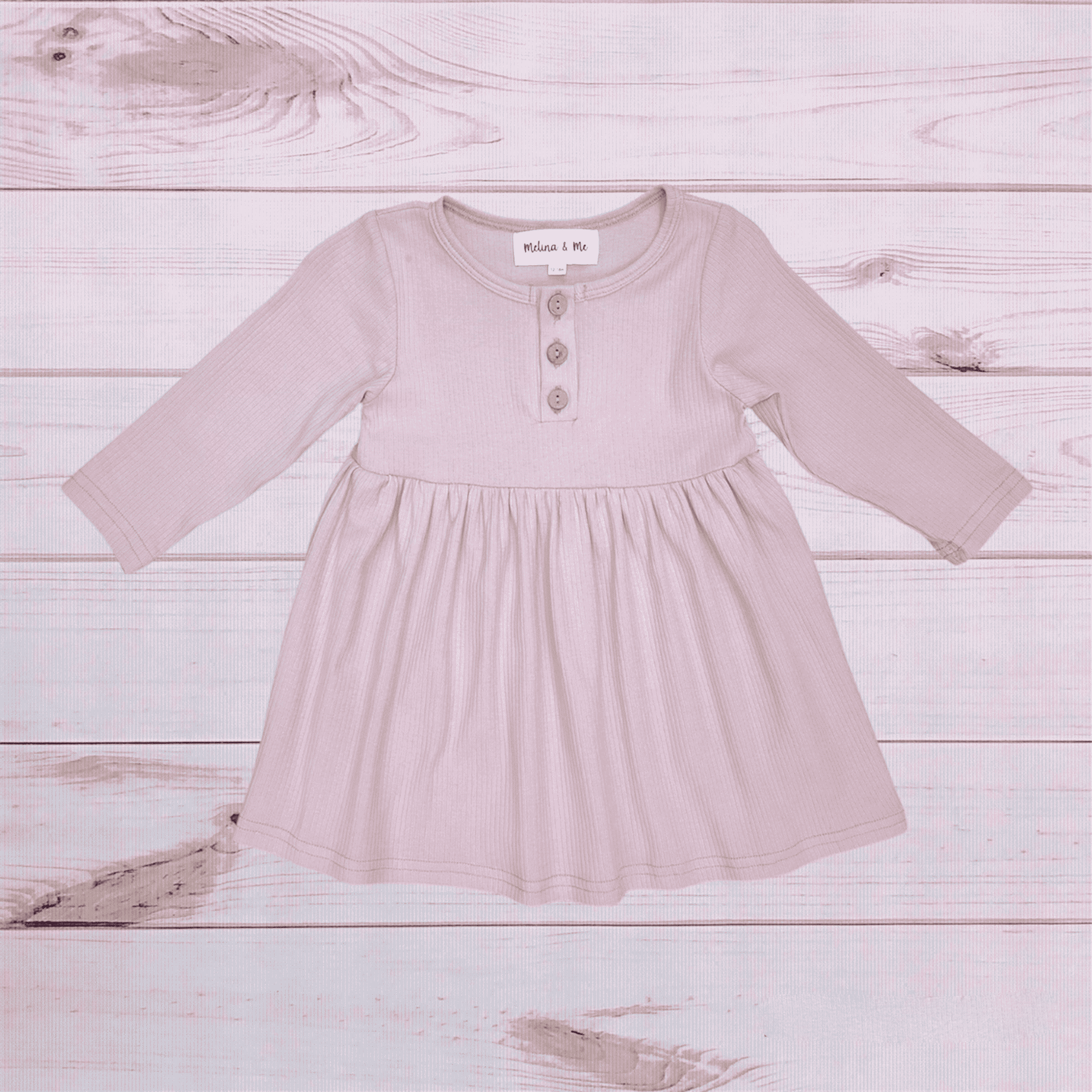 Ribbed long-sleeve dress in pale rose with button placket and gathered skirt