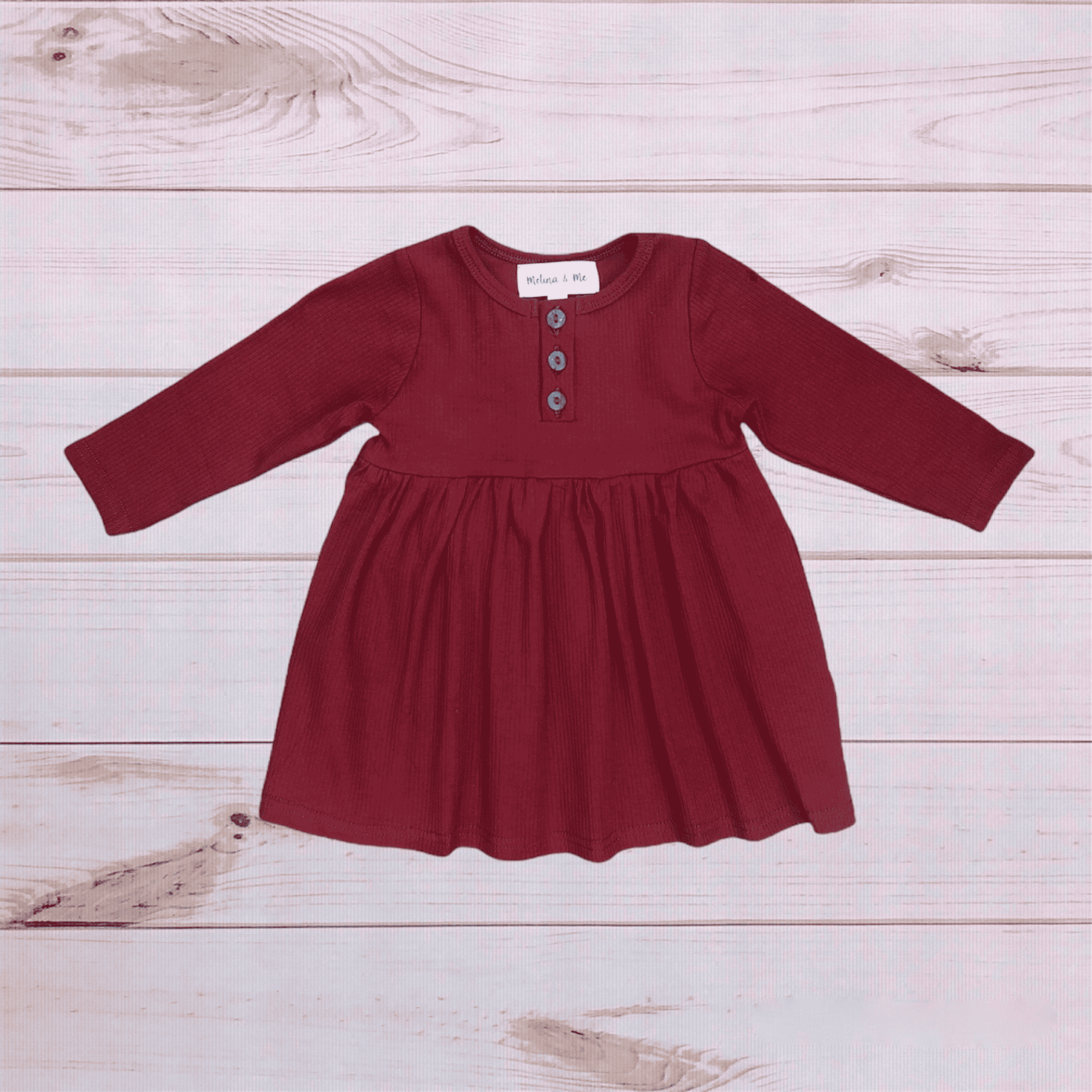 Ribbed long-sleeve dress in dark berry with button placket and gathered skirt