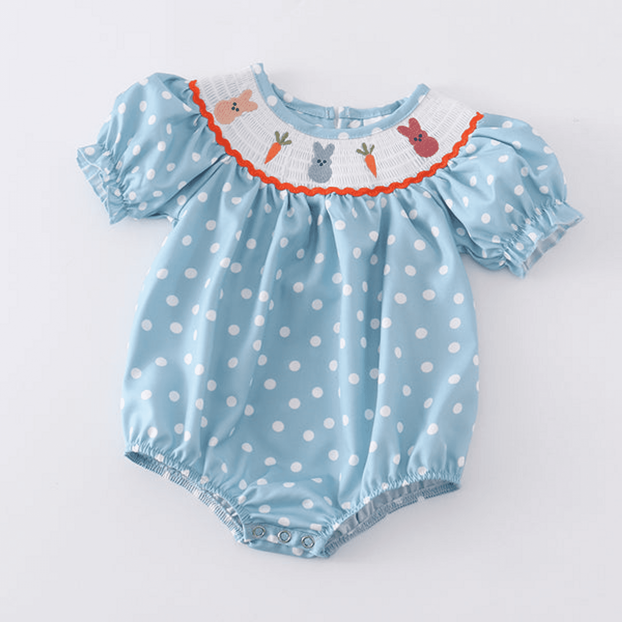 Girls' smocked bunny romper in light blue with white polka dots and ruffled animal bib