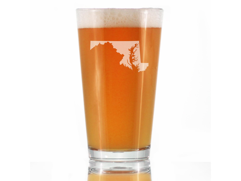 Tall pint beer glass with foamy top and etched Maryland outline