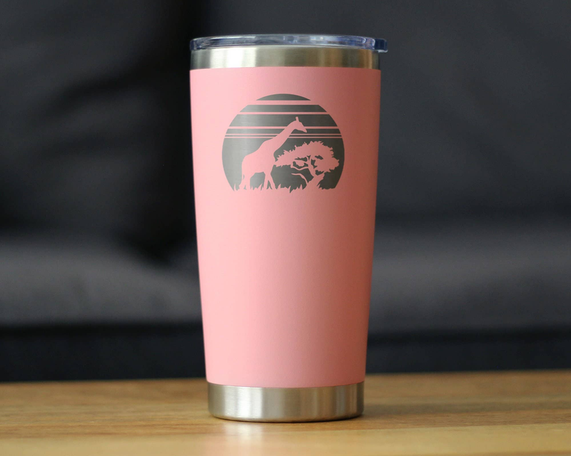 Pink insulated travel tumbler with stainless steel base and giraffe sunset emblem