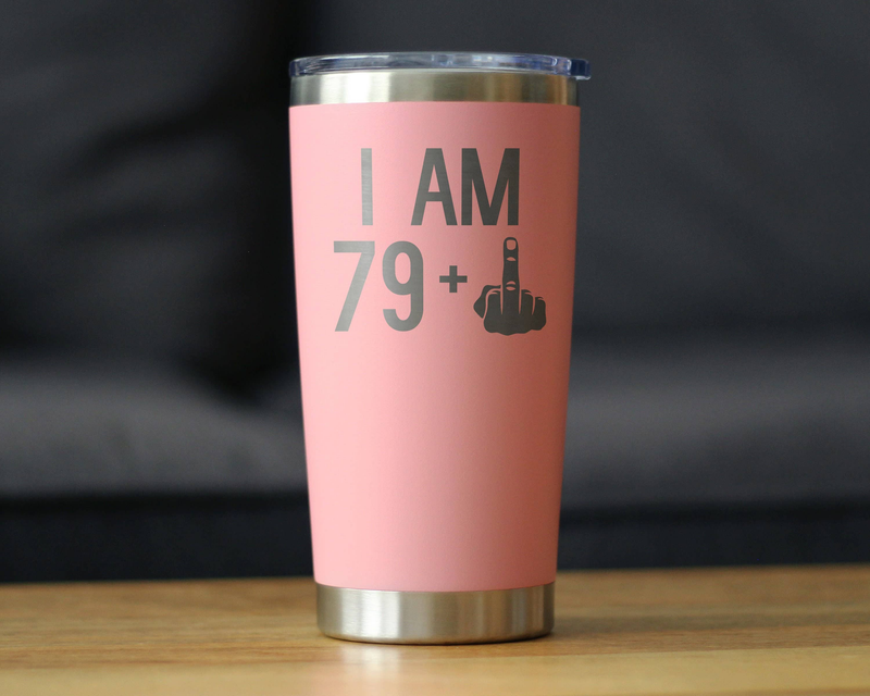 Pink insulated travel tumbler with 'I AM 79+' design and hand icon