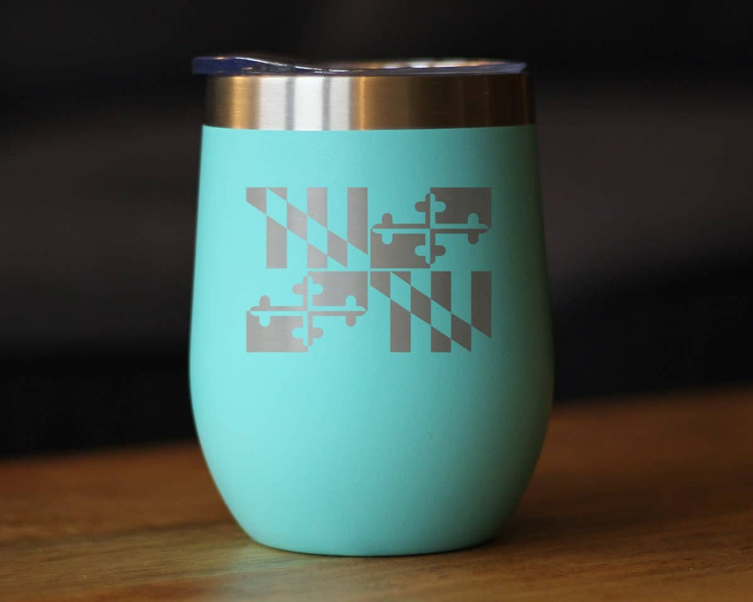 Teal insulated wine tumbler with etched Maryland emblem and stainless steel lid