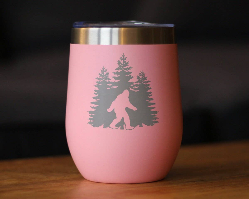 Pink insulated wine tumbler with laser-etched Bigfoot and pine trees on front