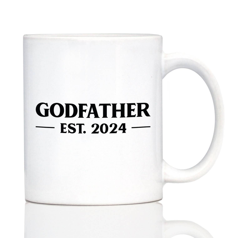 White ceramic coffee mug close-up with handle; “GODFATHER” and “EST. 2024” centered.