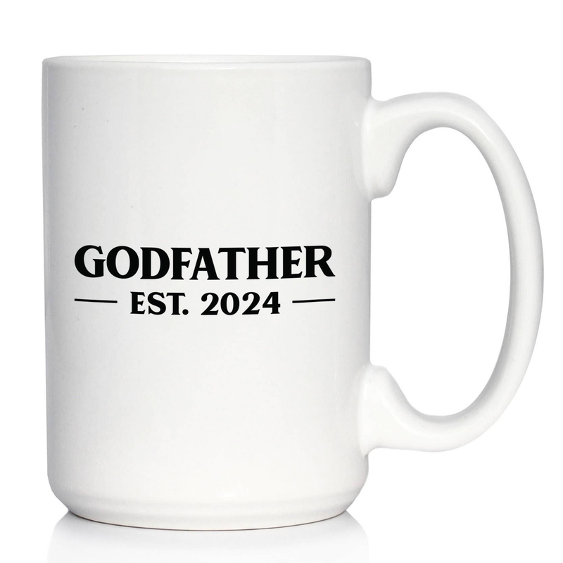 White ceramic coffee mug with handle; “GODFATHER” and “EST. 2024” black print.