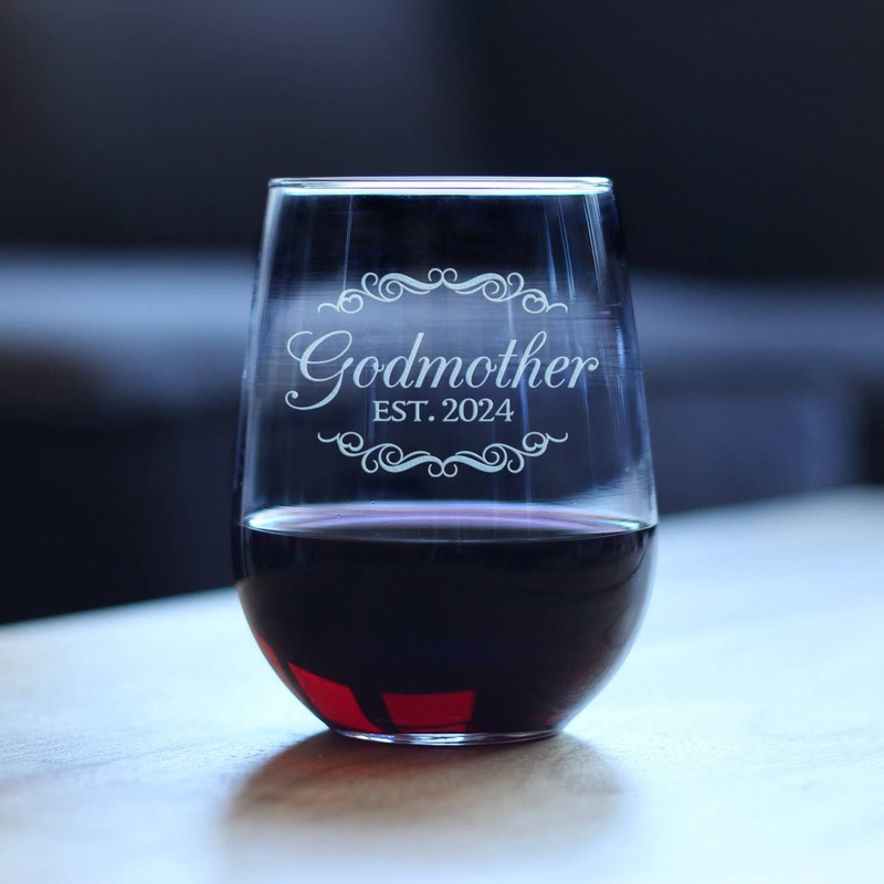 Stemless wine glass with dark red wine, etched “Godmother EST. 2024”