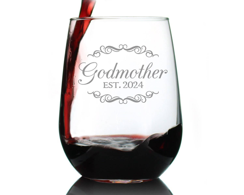Stemless wine glass with dark red wine and etched “Godmother EST. 2024”
