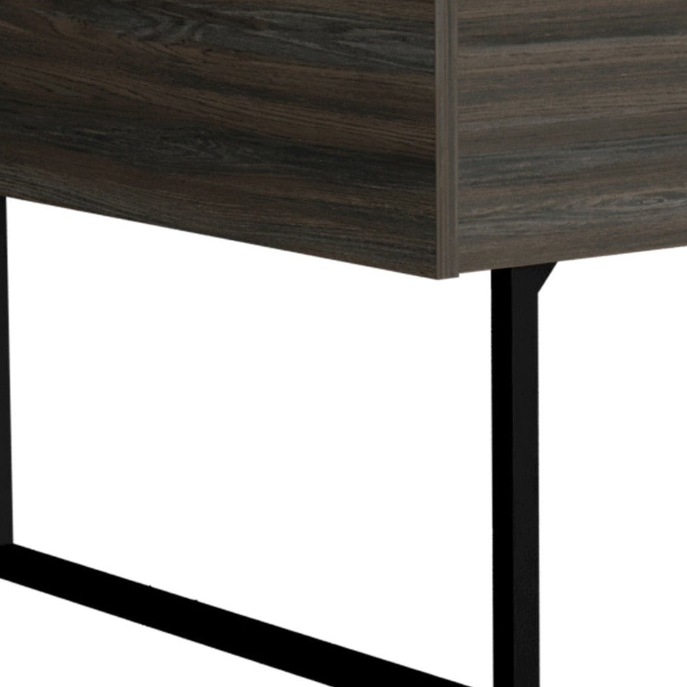 Close-up of dark espresso coffee table side panel and black metal leg supports