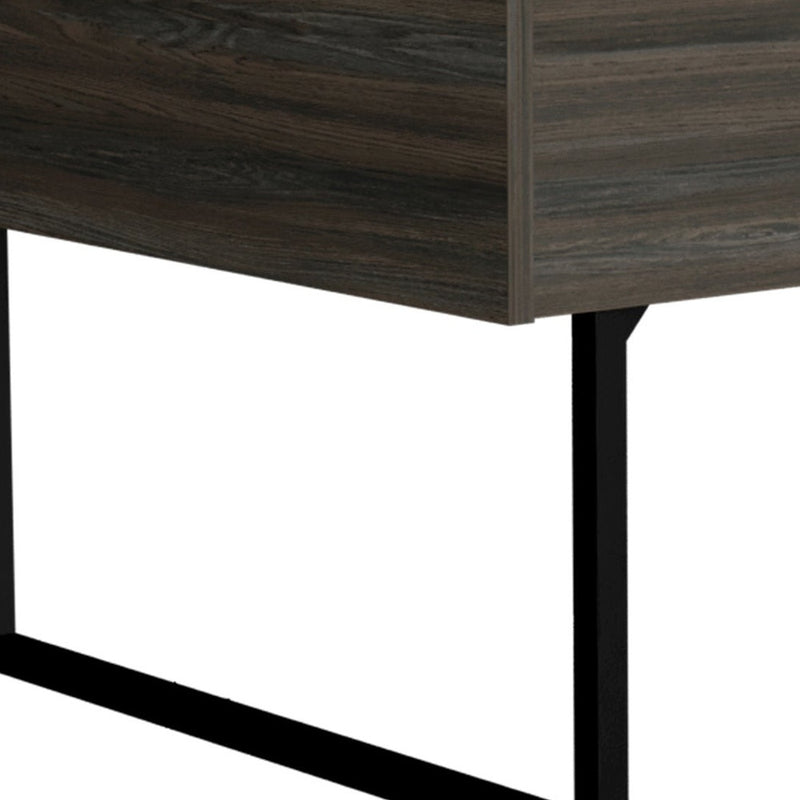 Close-up of dark espresso coffee table side panel and black metal leg supports