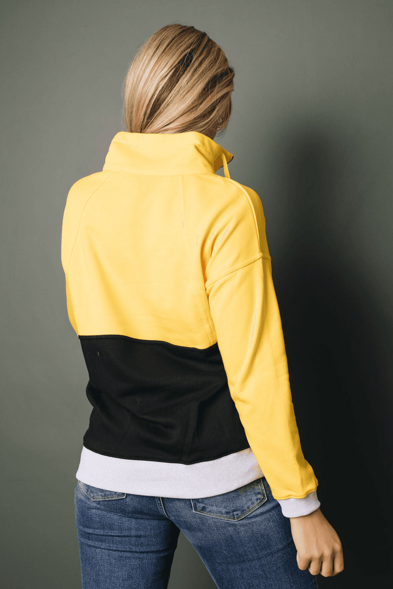 Yellow zip-up colorblock sweatshirt with black back panel and white hem