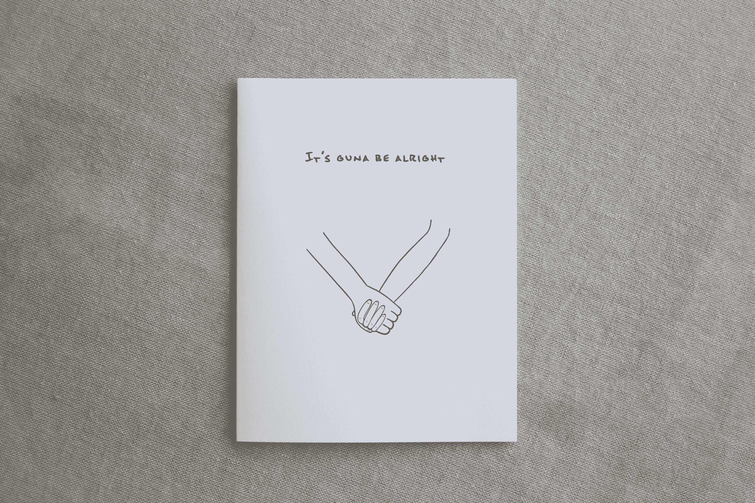 White sympathy card with 'It's Guna Be Alright' and clasped hands line illustration.