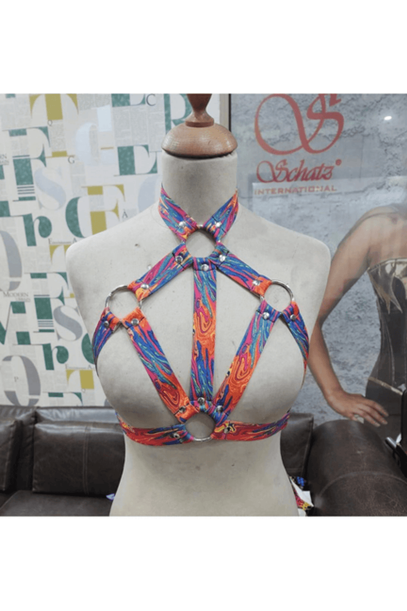 Tie-dye stretchy body harness with silver hardware, shoulder straps with O-ring details