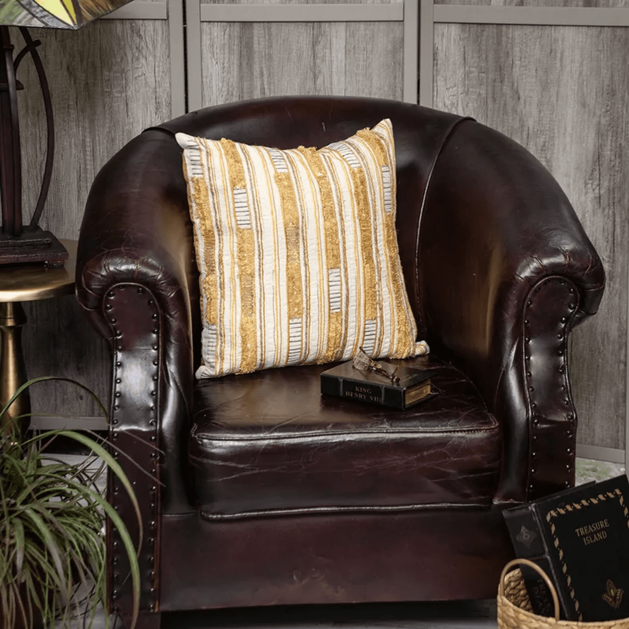 Multicolor striped pillow cover with vertical gold-and-white stripes, fringed trim