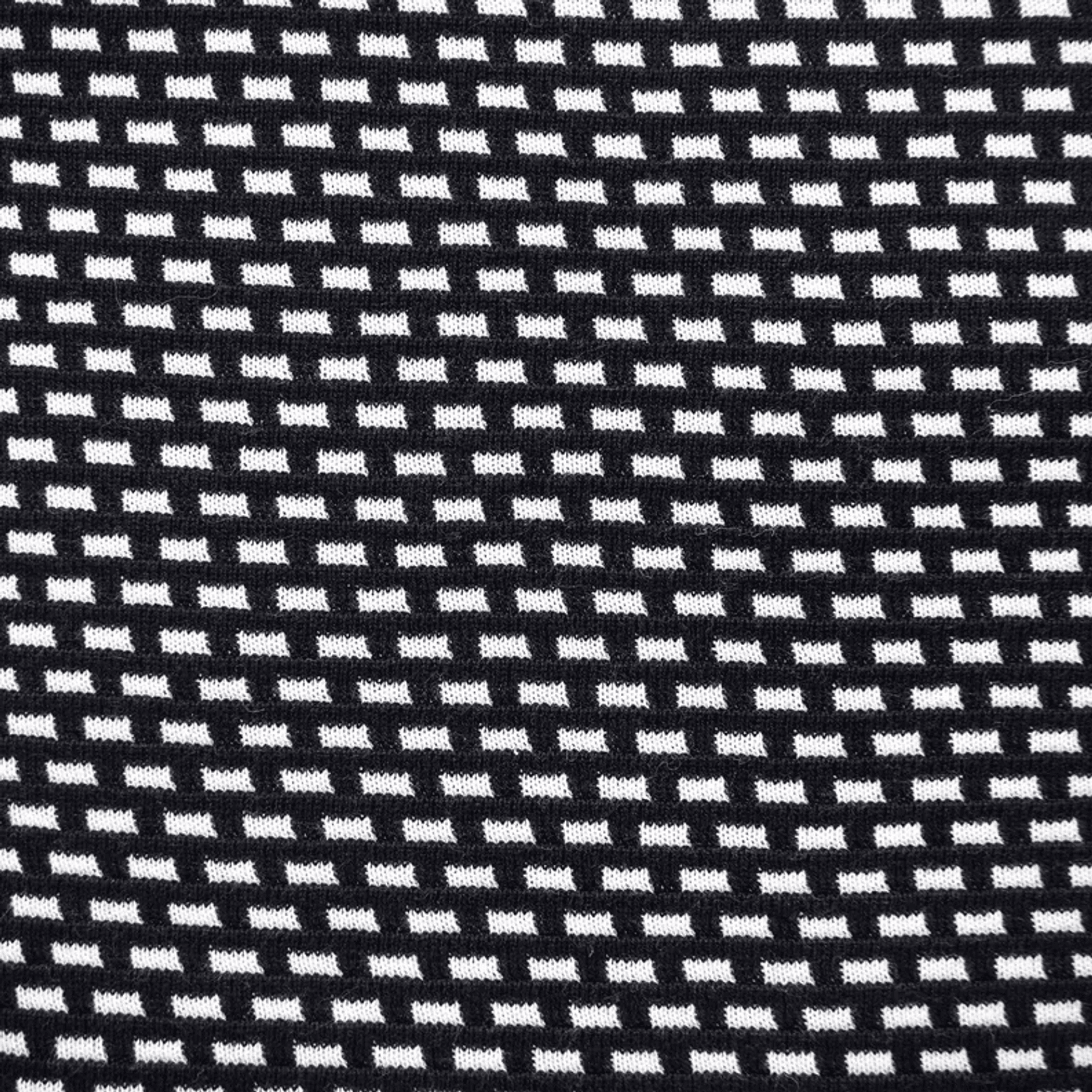 Close-up woven fabric of black and white grid pattern throw pillow