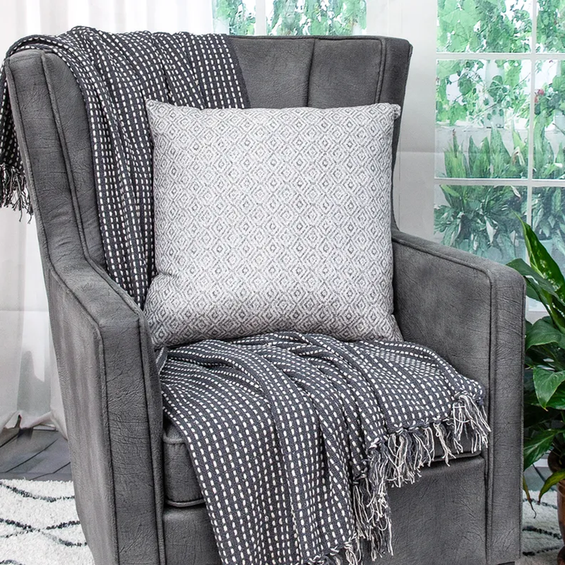 Mudra gray throw pillow with repeating geometric diamond pattern