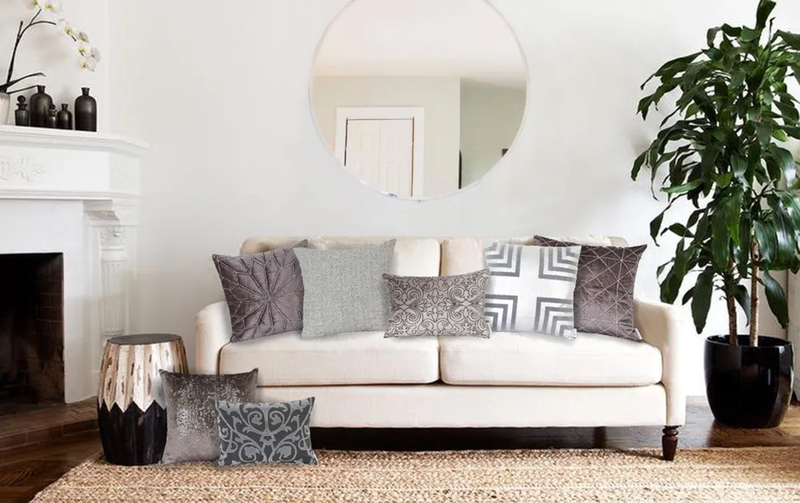 Mudra gray throw pillow with gray-and-white patterned lattice design