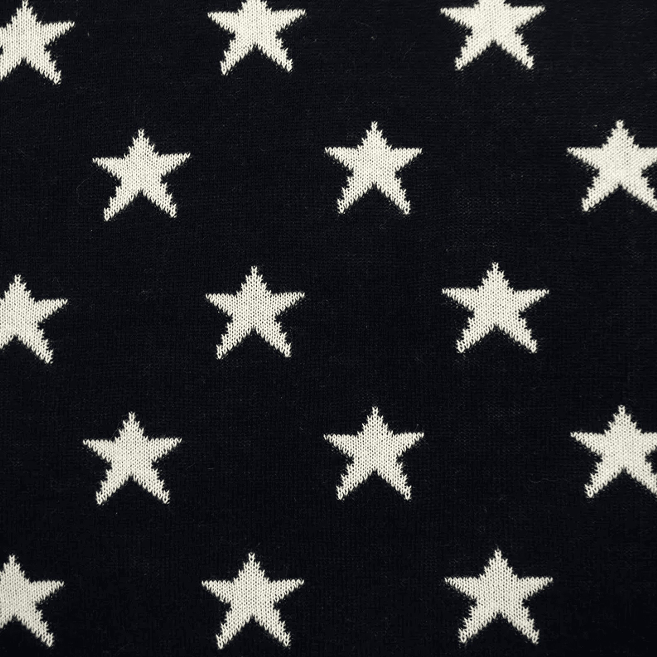Navy throw pillow with scattered white star pattern
