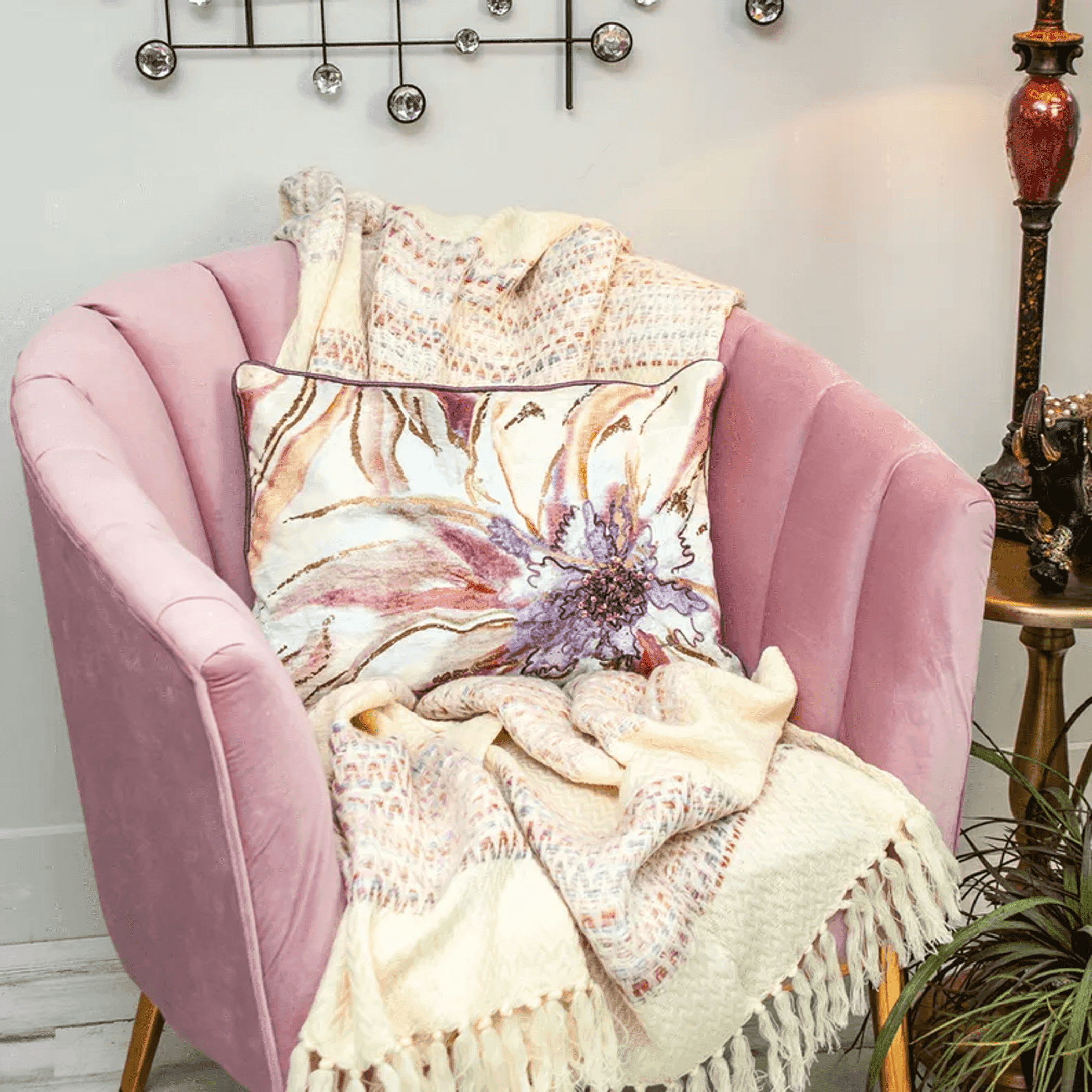Floral accent pillow cover with purple beaded centerpiece on cream base