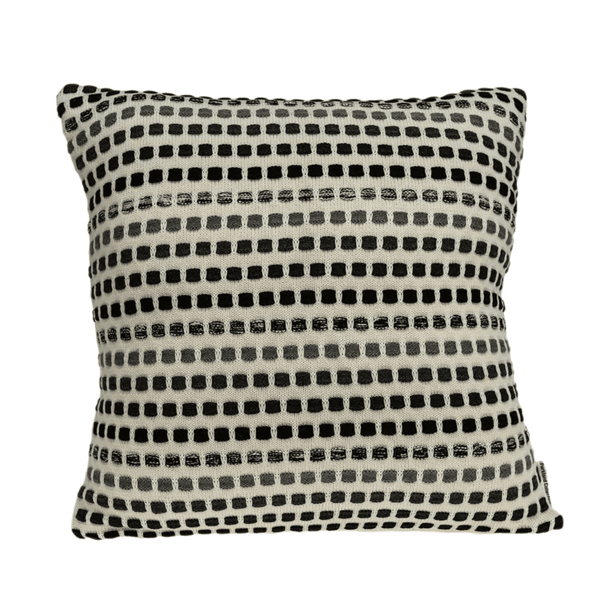 Beige throw pillow with black and white horizontal dot pattern