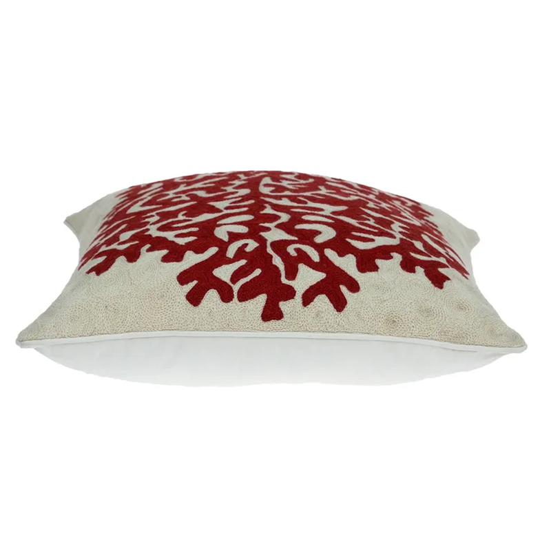 Beige pillow with red coral pattern front and stitched edge