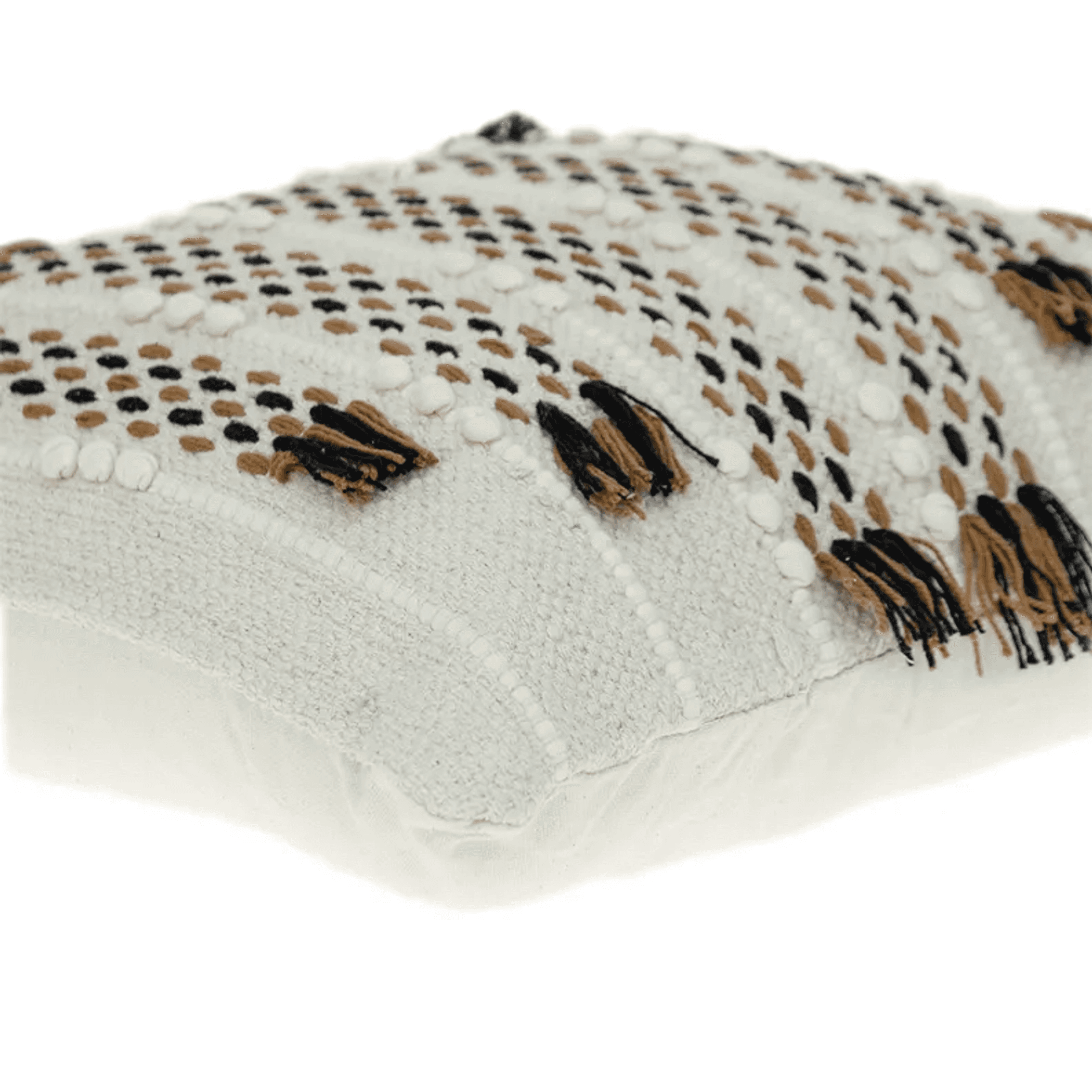 Beige knit throw pillow corner detail with geometric dots and fringe tassels