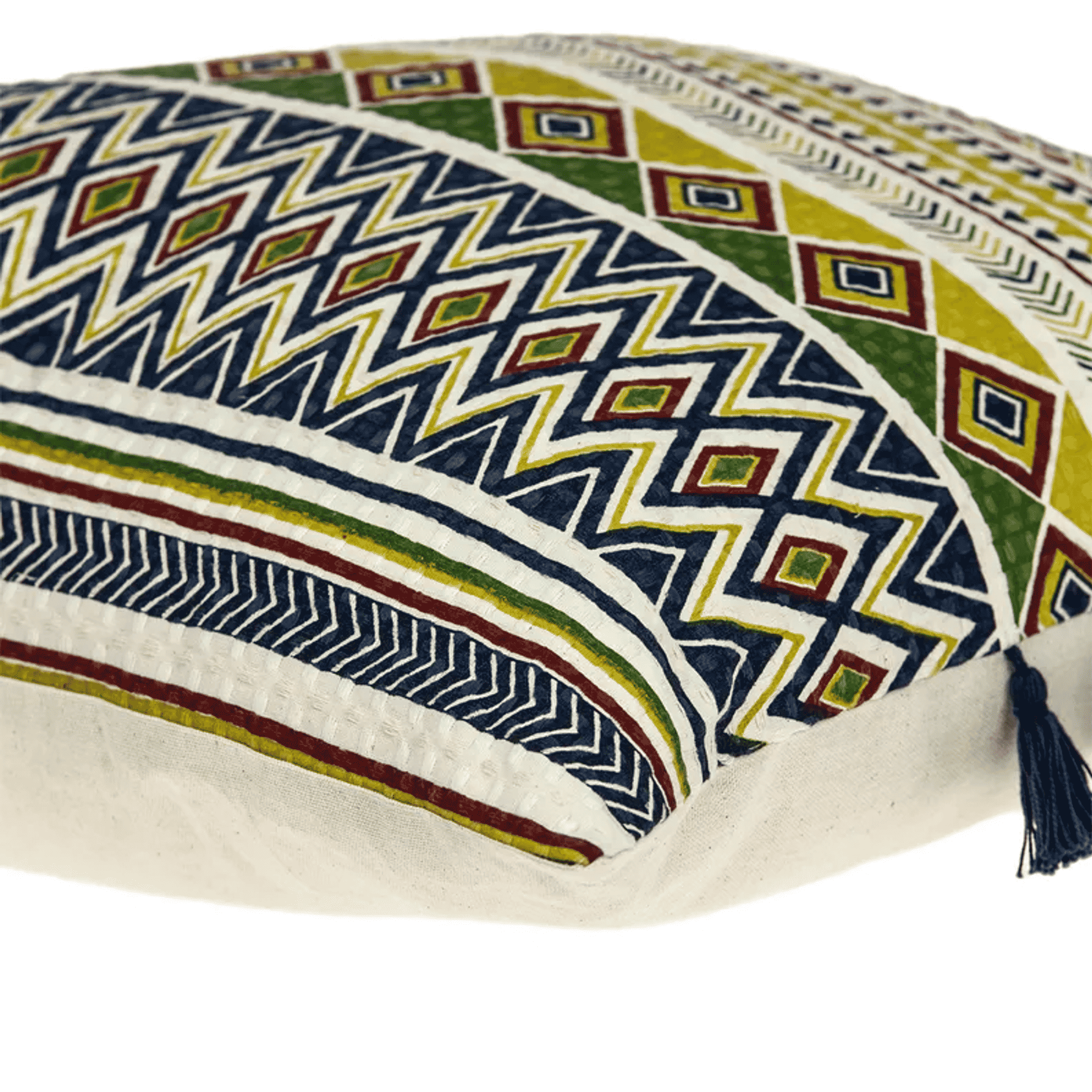 Close-up of multicolor geometric throw pillow with navy tassel at the corner
