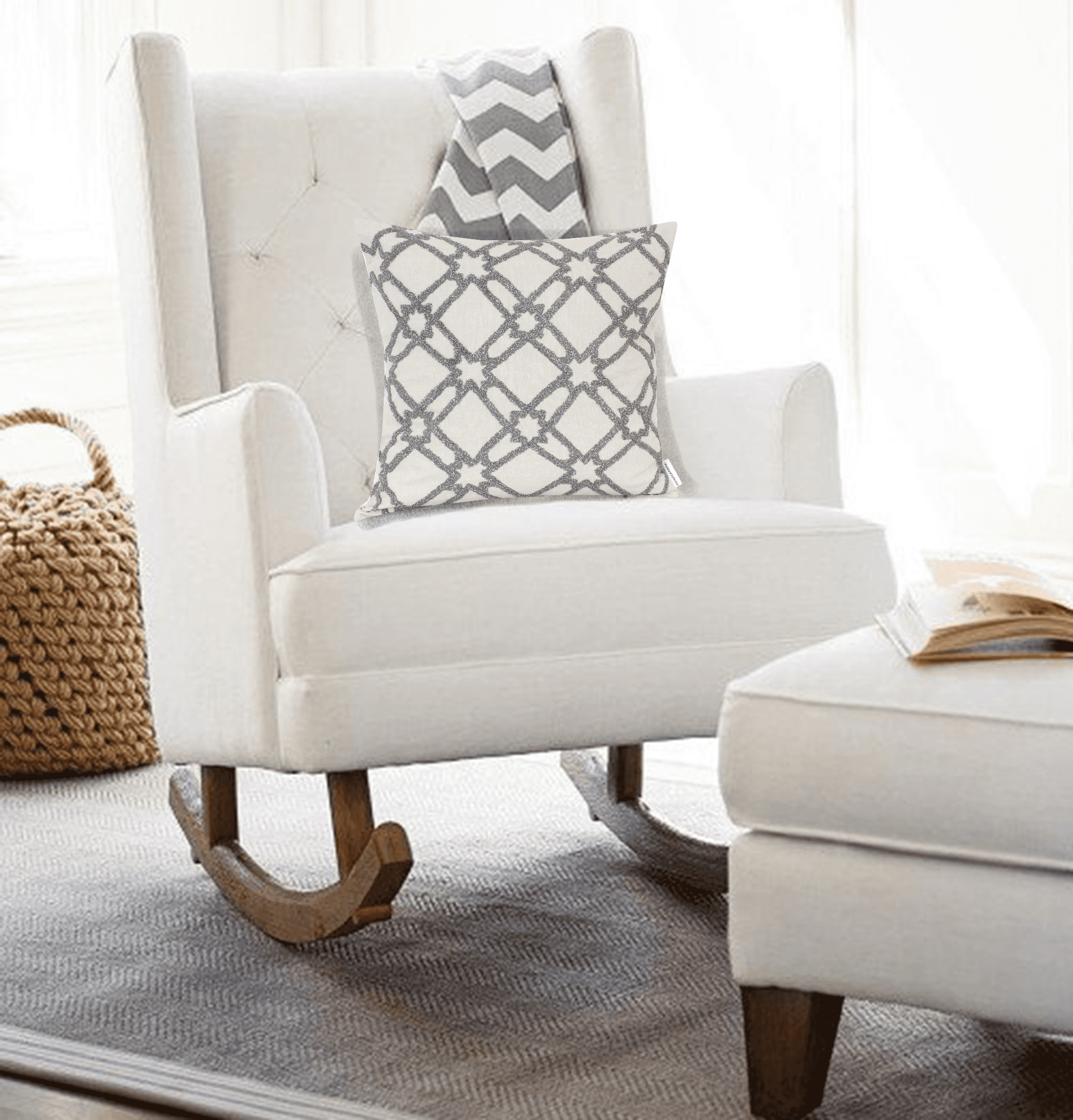Beige throw pillow with dark gray geometric lattice pattern on a white armchair