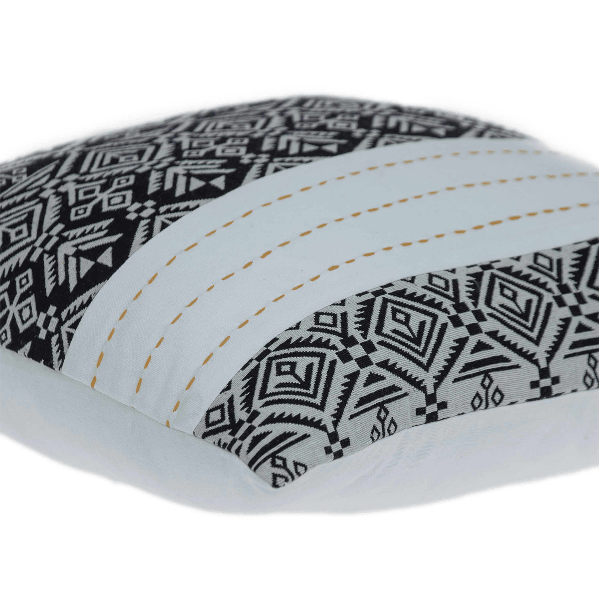 Close-up of black-and-white geometric throw pillow with tan dotted white stripes
