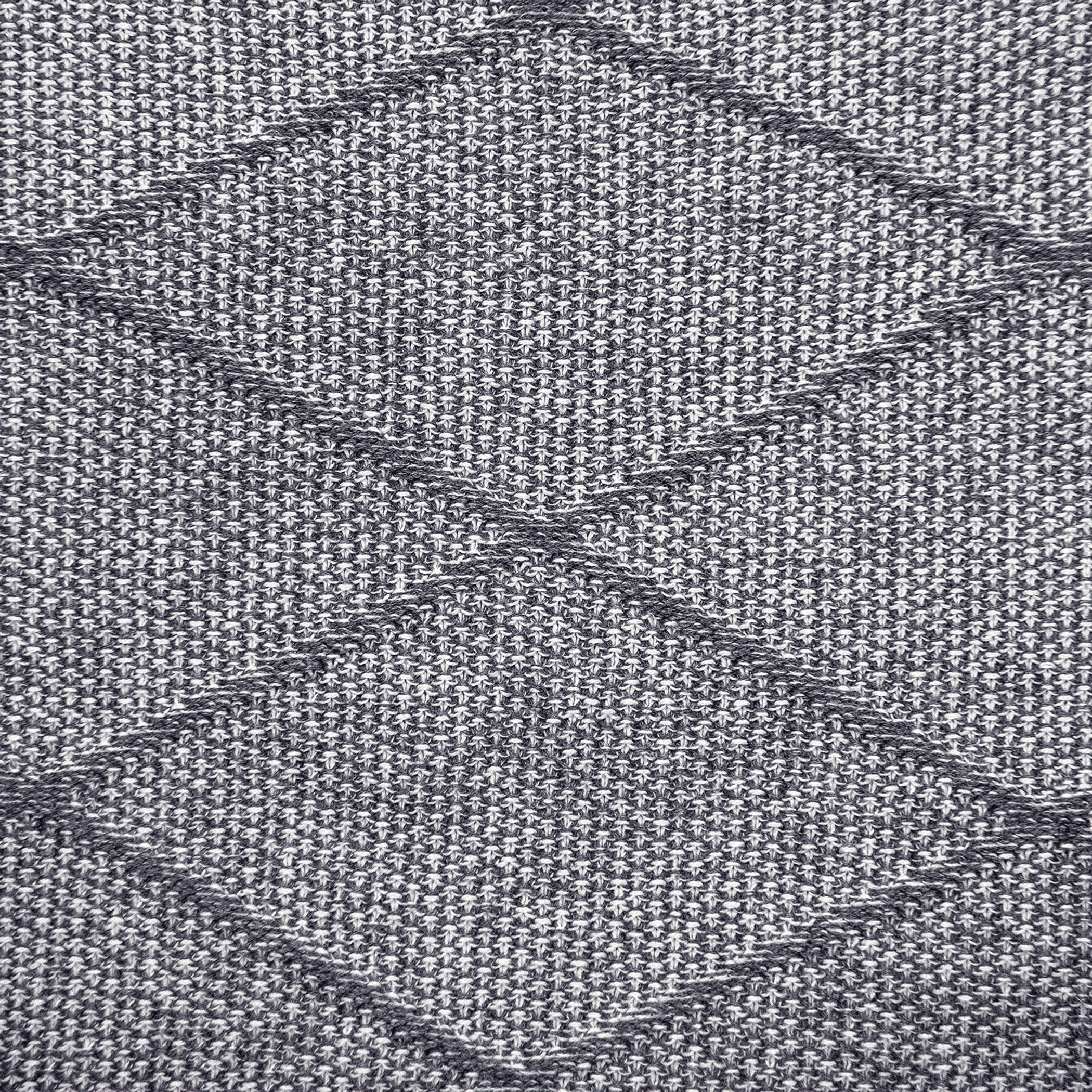 Close-up of gray woven fabric with diamond quilted channels and crosshatch stitching