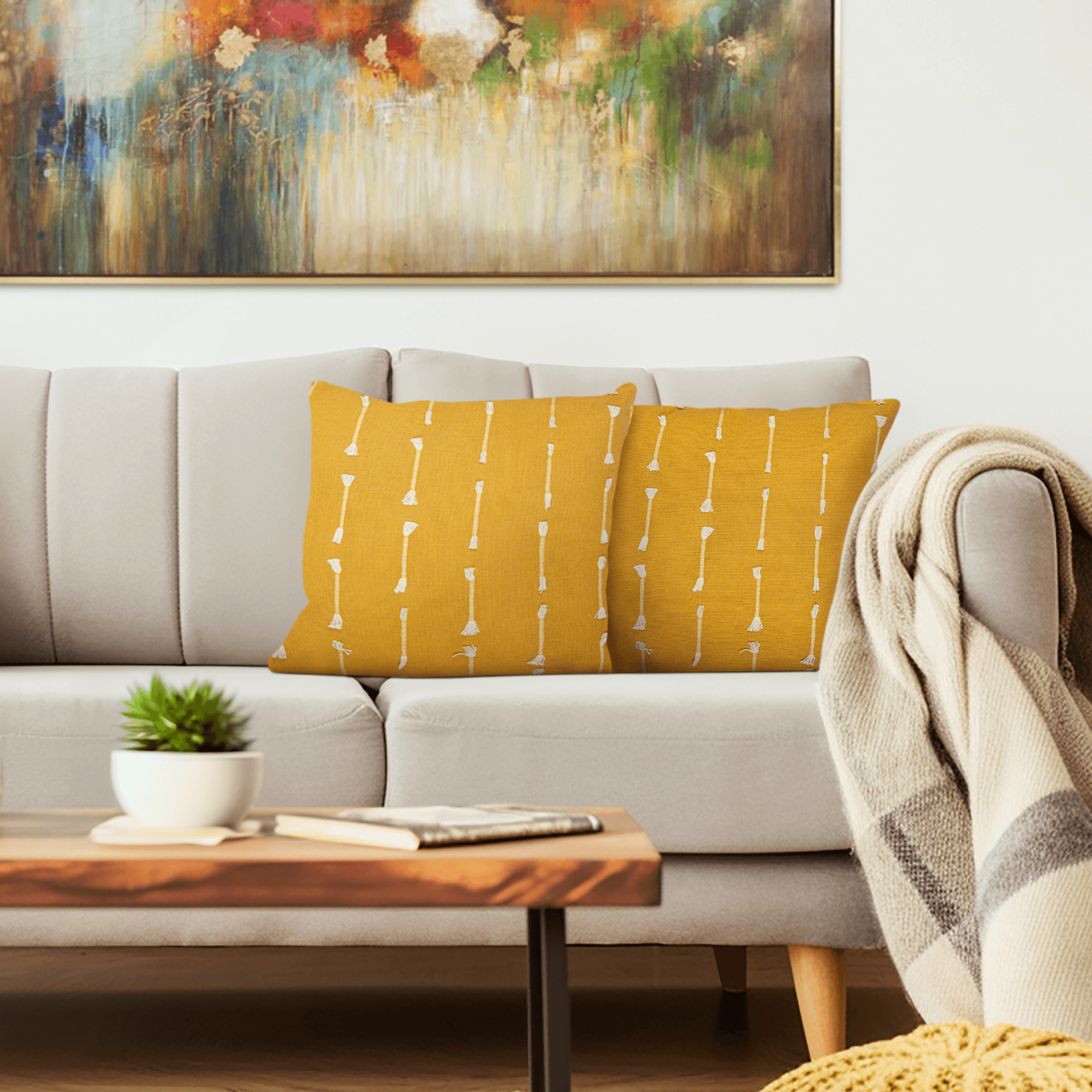 Yellow 18x18 cotton throw pillow with white stripe pattern on sofa cushion