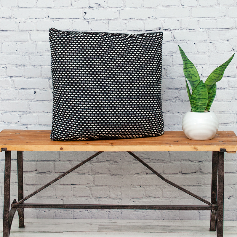 Black and white textured square throw pillow with tight woven pattern