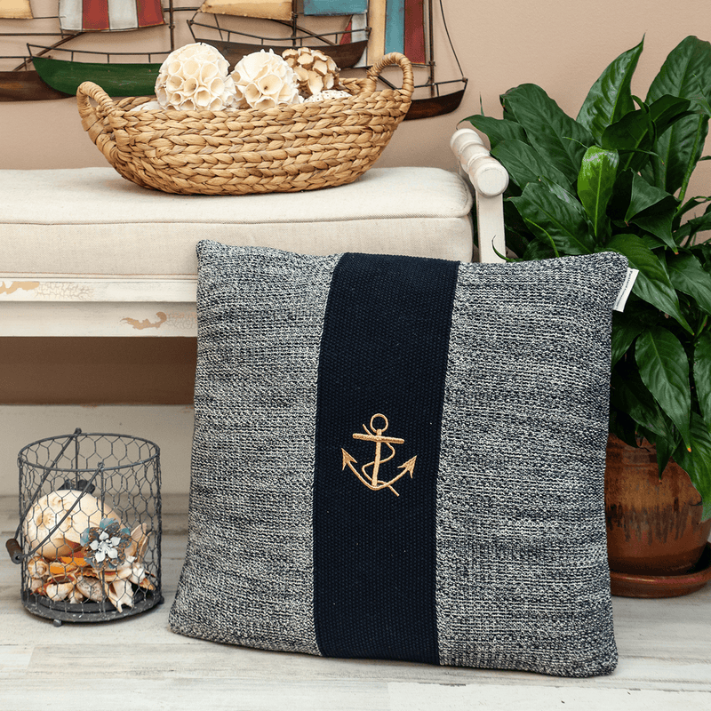 Nautical throw pillow with gray fabric, black center stripe, gold anchor emblem