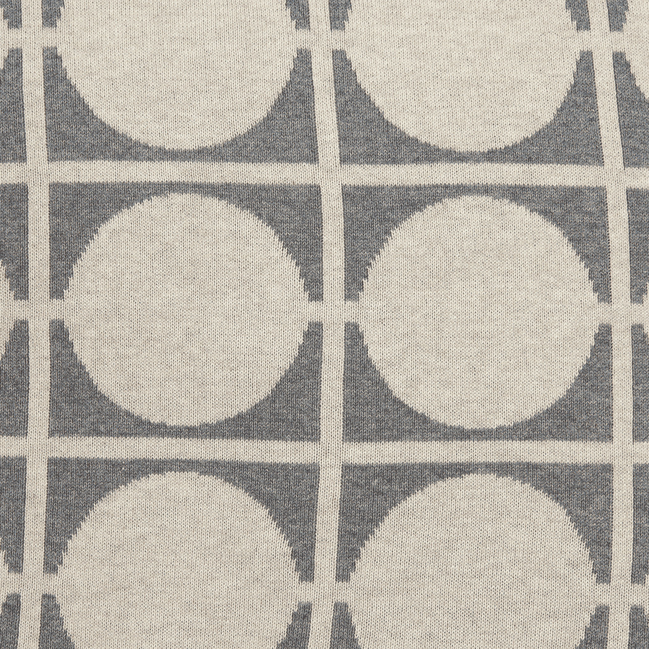 Beige and gray woven throw pillow fabric with circular grid pattern detail