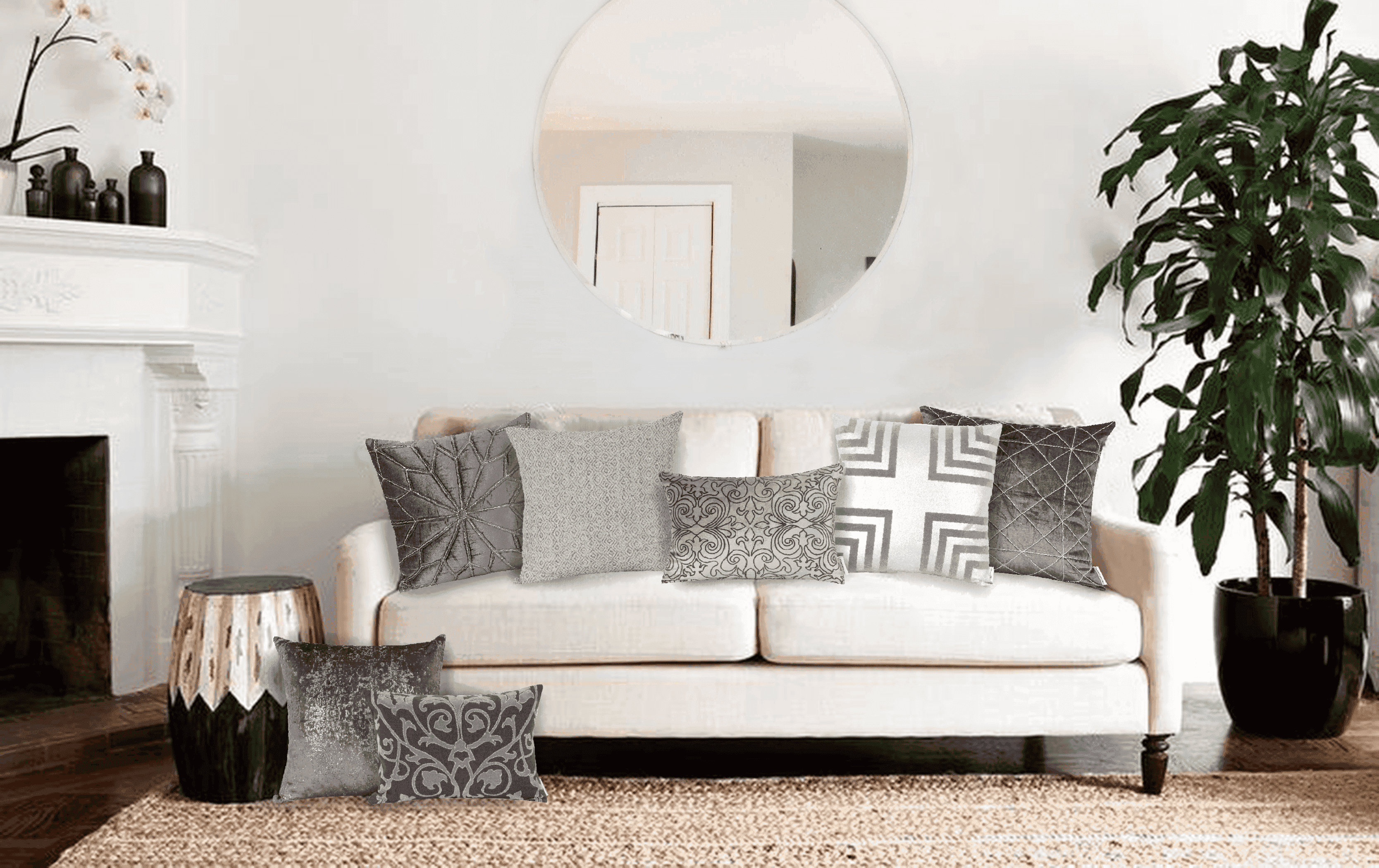 Gray throw pillow with decorative geometric pattern and stitched accents, on a sofa.