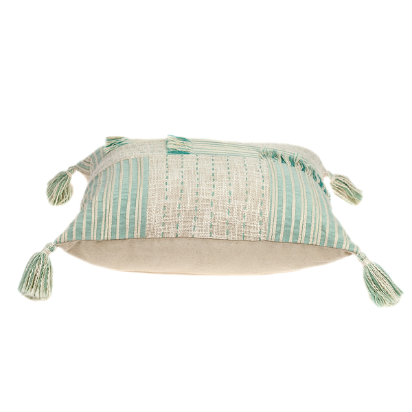 Cream throw pillow with mint striped fabric and tassel corners