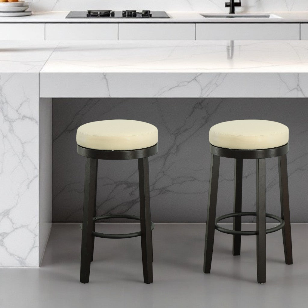 Set of Two 30" Cream and Espresso Faux Leather and Solid Wood Backless Bar Height Swivel Bar Chairs